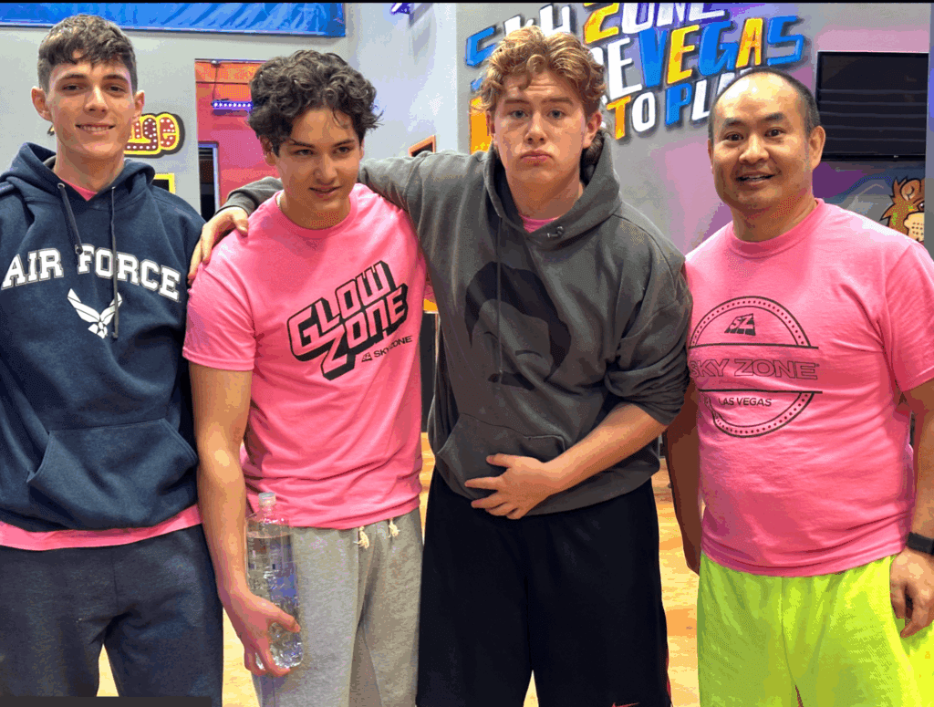 Elias and friends at Sky Zone Las Vegas in February 2023 wearing neon pink shirts